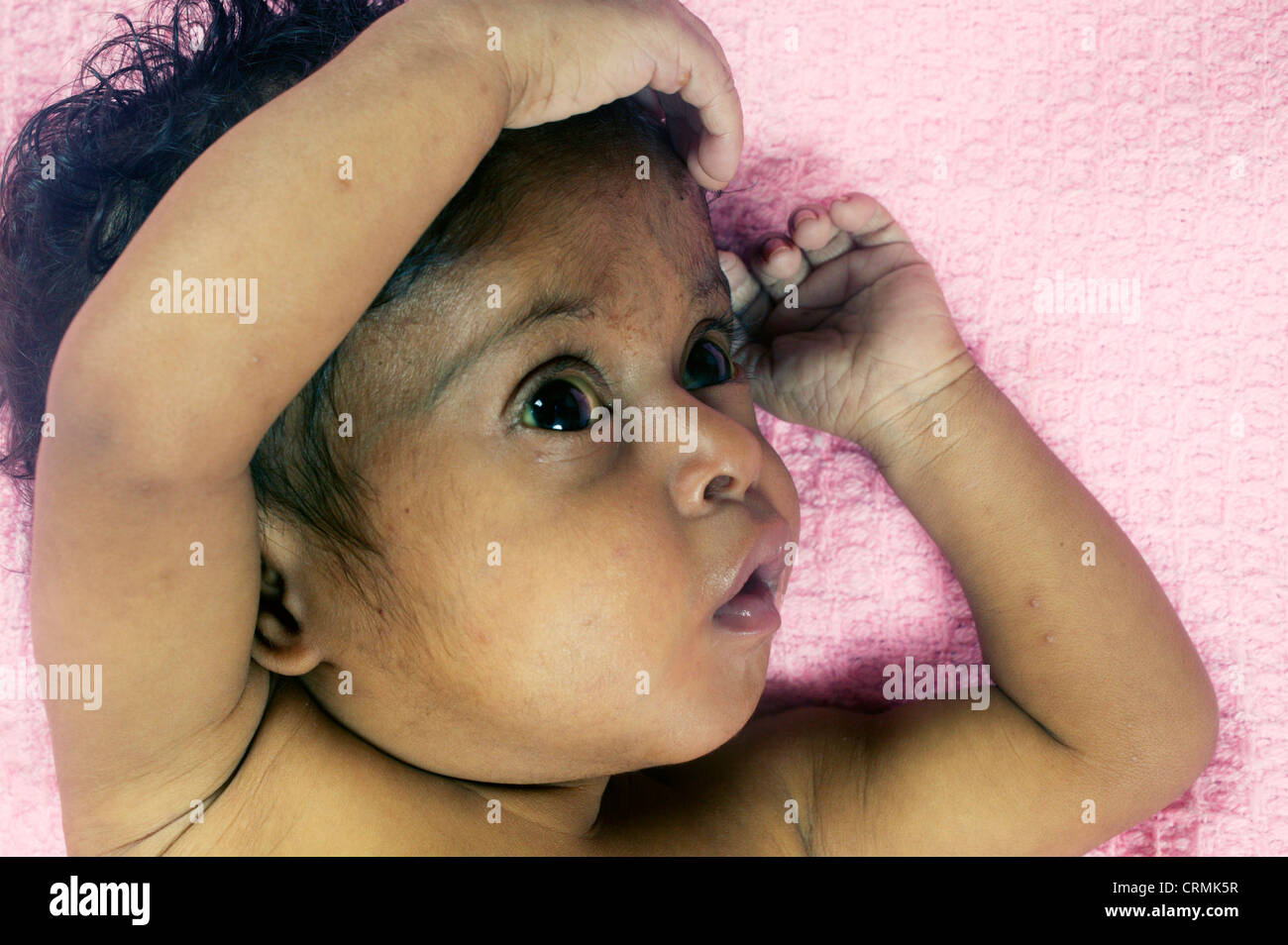 small baby in hospital bed very ill Stock Photo