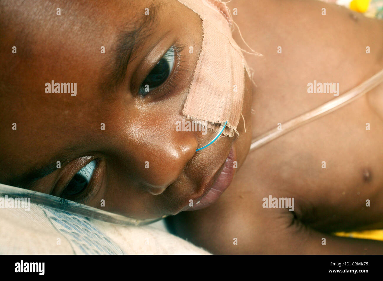 small baby in hospital bed very ill Stock Photo