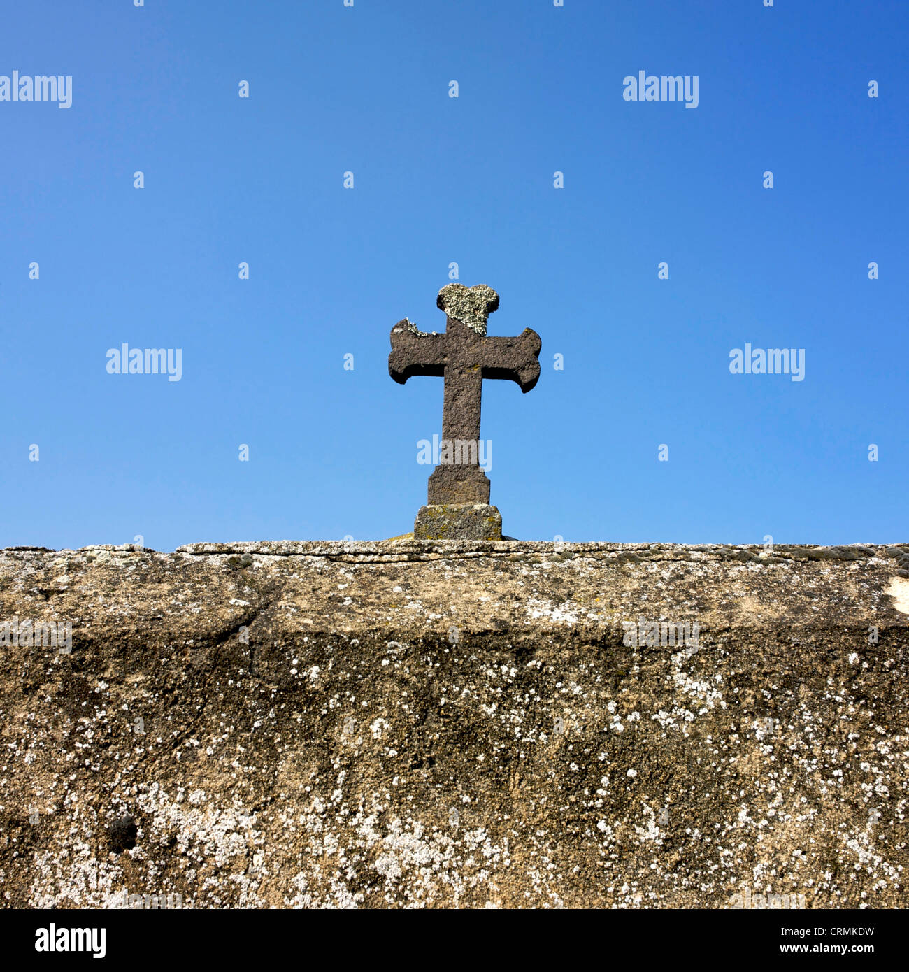 Stone cross in a cemetery. Stock Photo
