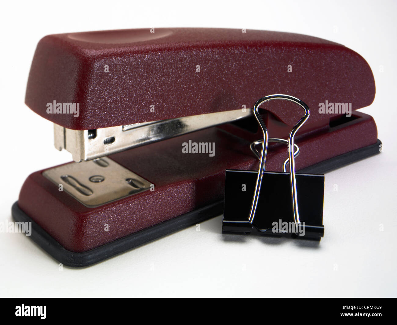 A stapler and a bulldog clip Stock Photo
