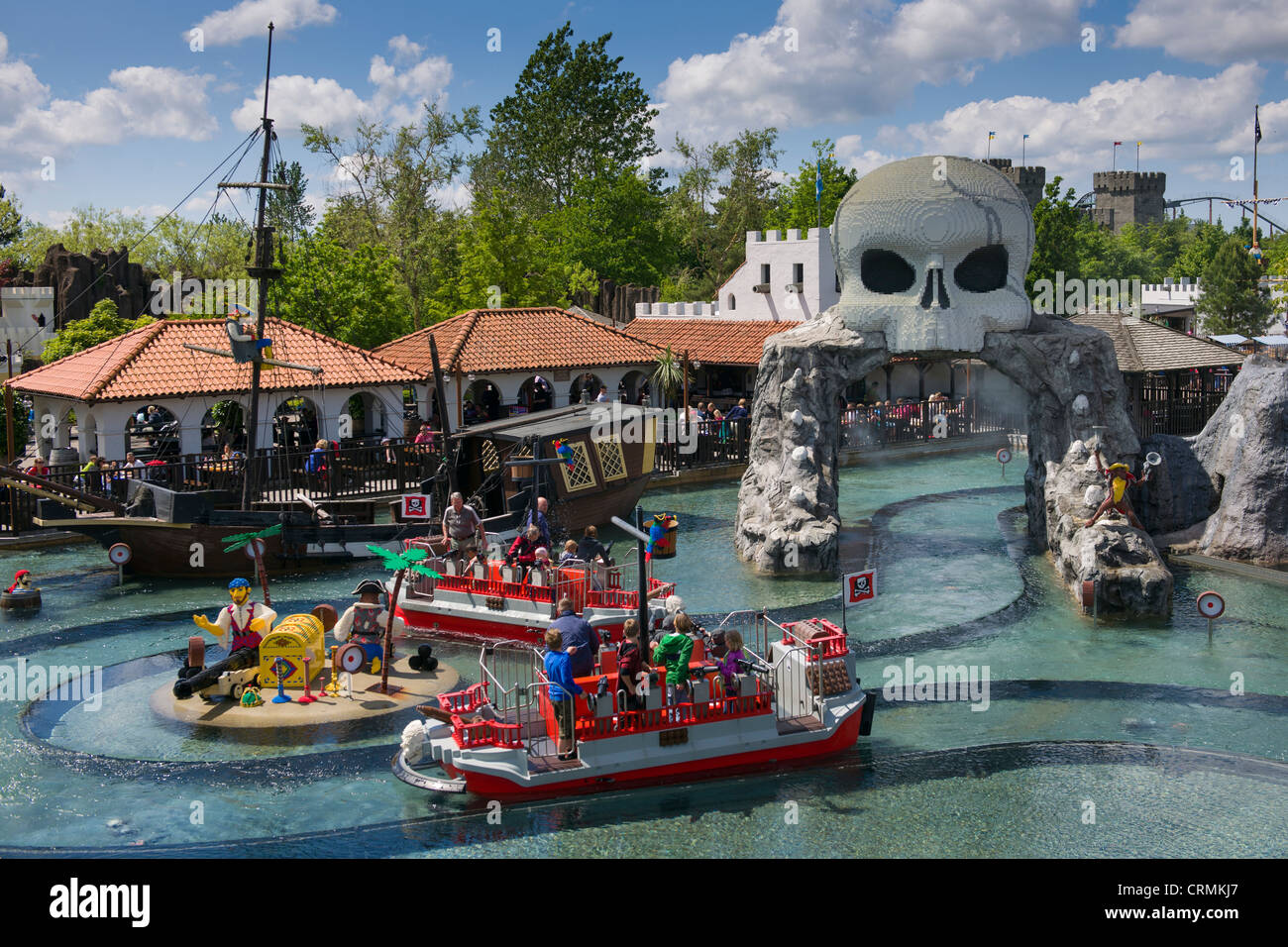 Water fights aboard Lego boats at Pirateland with skull gateway, Legoland, Billund, Denmark Stock Photo