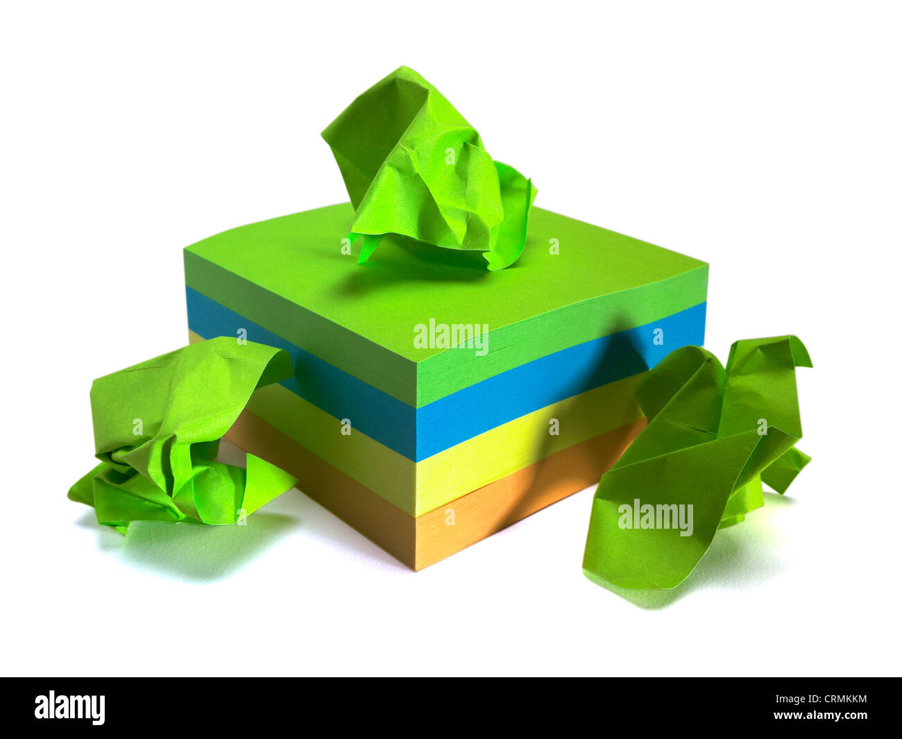 A block of coloured sticky notes, three crumpled up Stock Photo