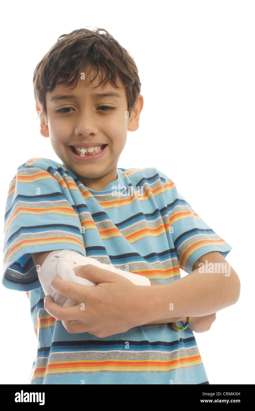 A young boy with a bandaged elbow, grimacing in pain Stock Photo Alamy