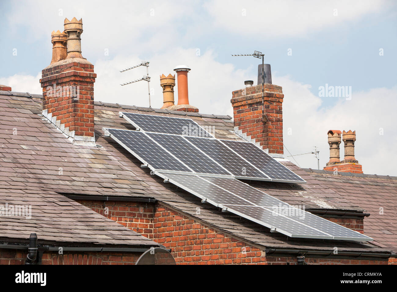Solar panels on an old Victorian terrace house roof in Macclesfield