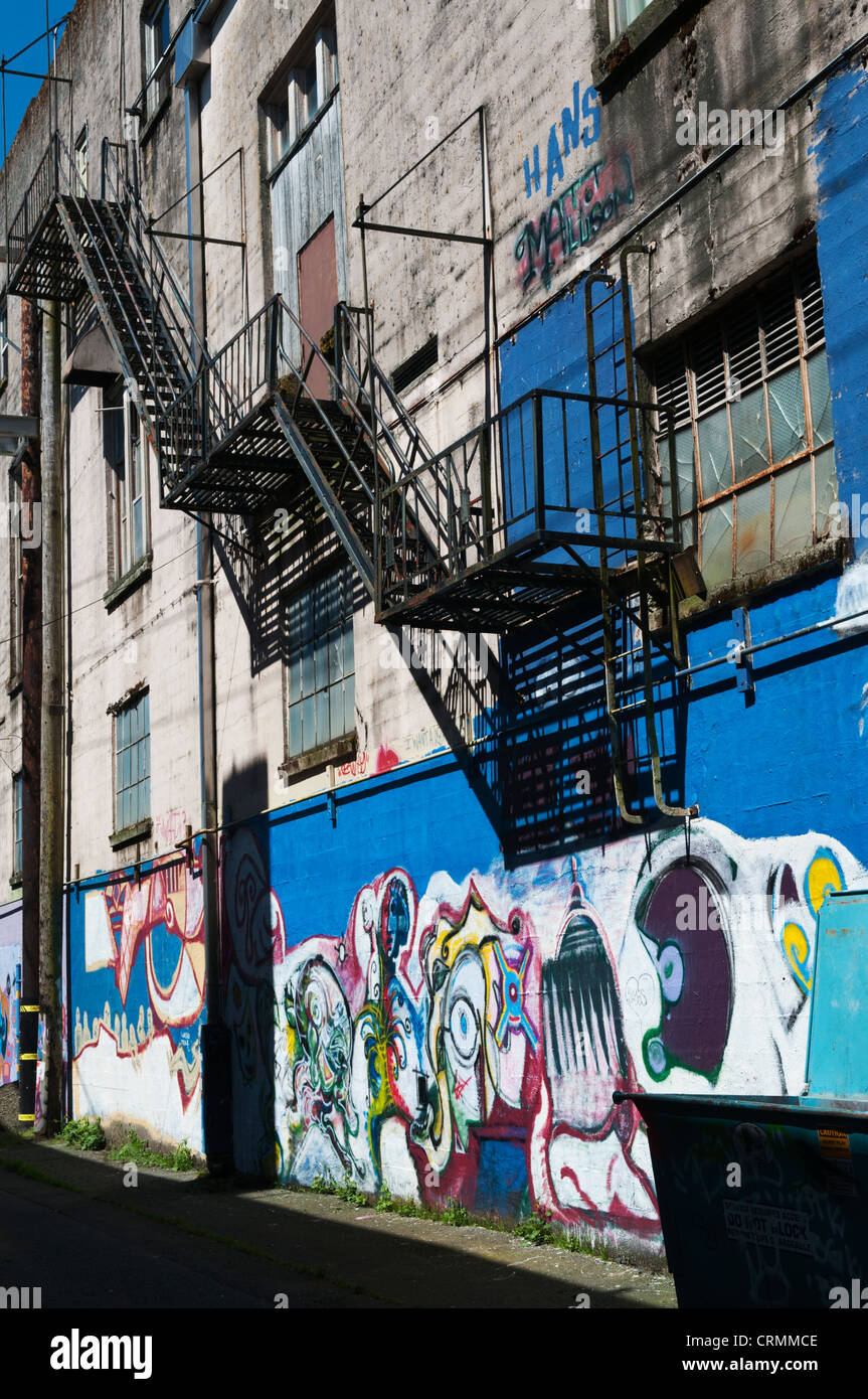 Fire escape stairs on  a graffiti painted wall in downtown Aberdeen, Washington. Stock Photo
