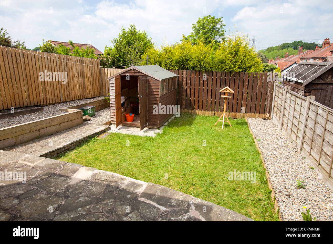 A small back garden of a post war 1940's semi detached house in Macclesfield, Cheshire, UK. Stock Photo