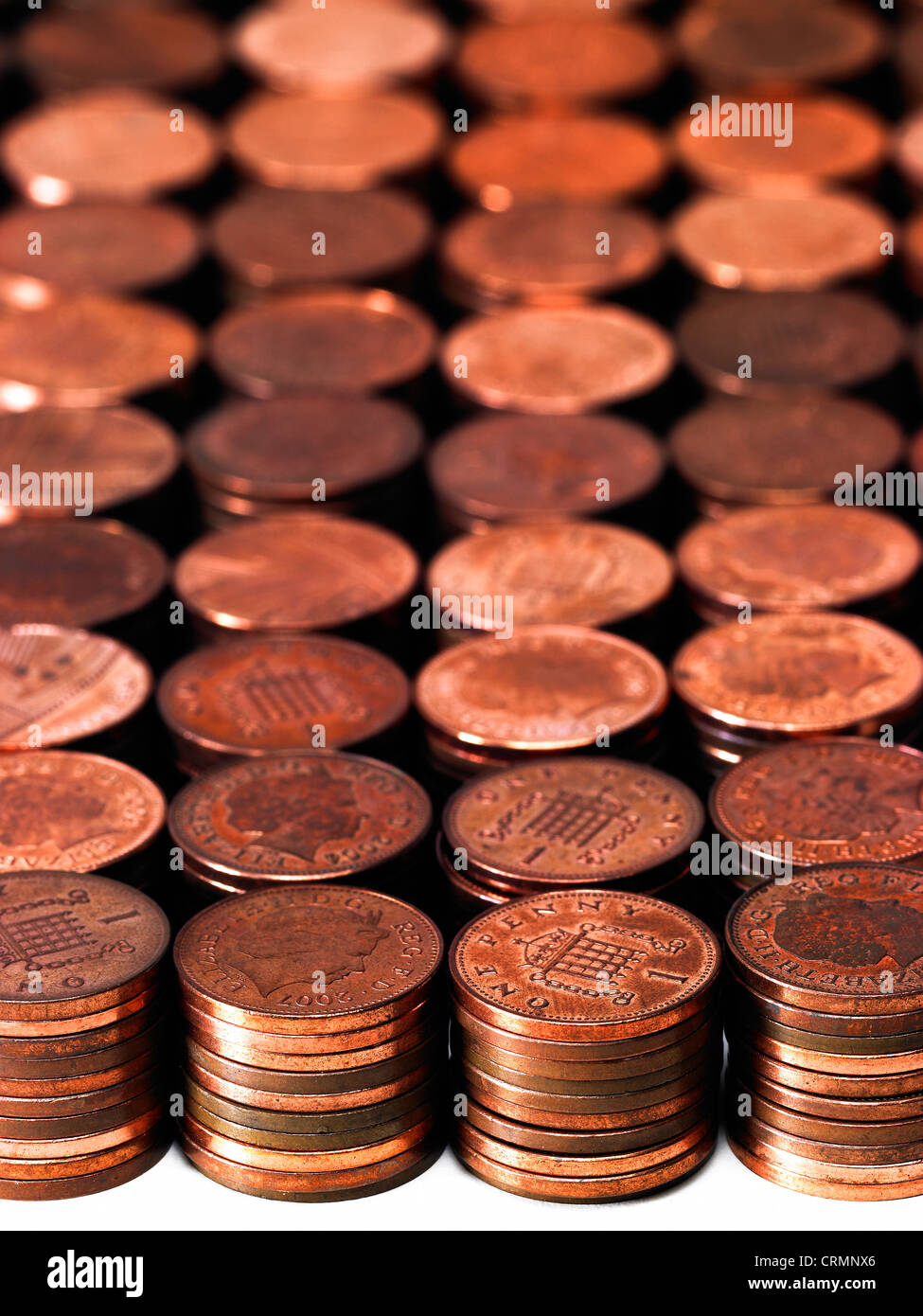 Neat piles of British pennies Stock Photo