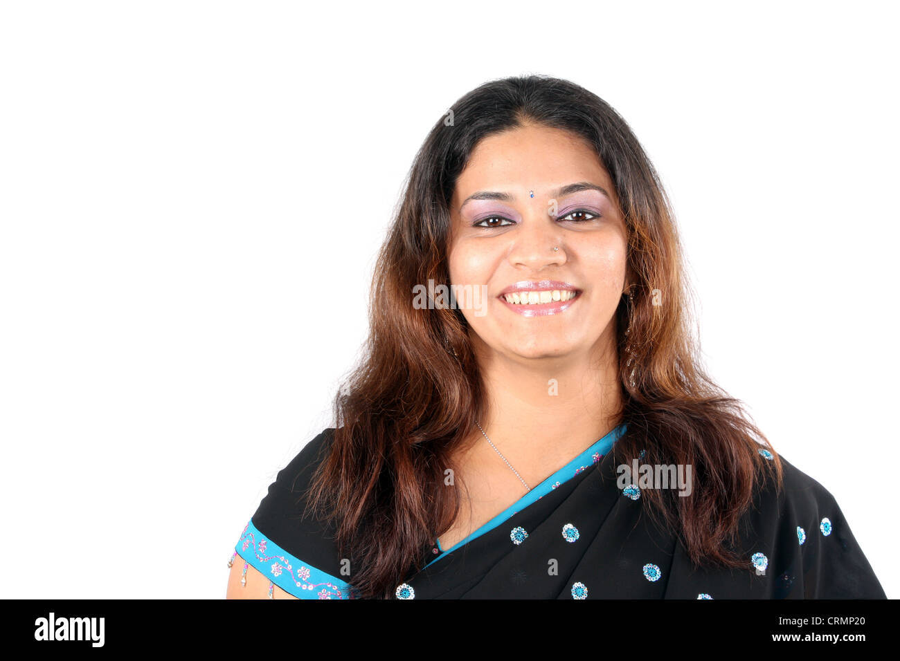 A portrait of a smiling beautiful Indian woman in a sari, on white ...