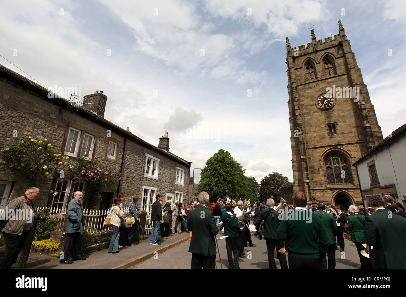 The Village Band Marching Through the Derbyshire Village of Youlgreave for the Blessing of the Well Dressings Stock Photo