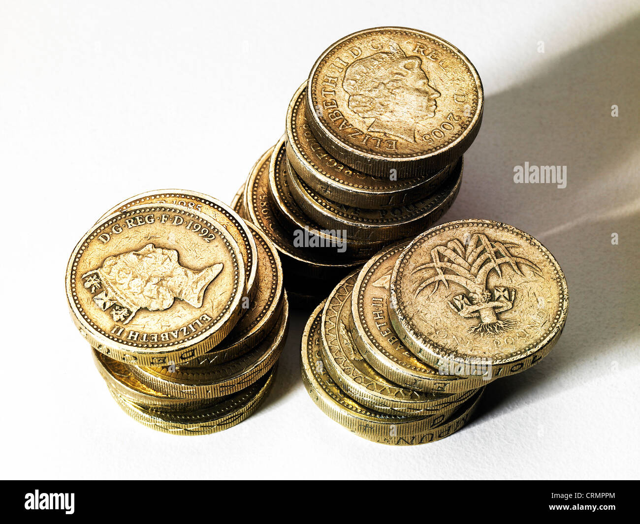 Three piles of British pound coins Stock Photo