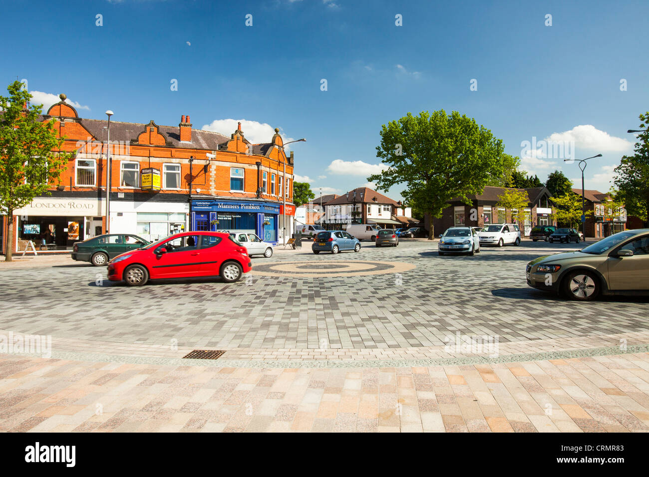 Poynton village in Cheshire uses a shared space where pedestrians and motorists share the space. Stock Photo