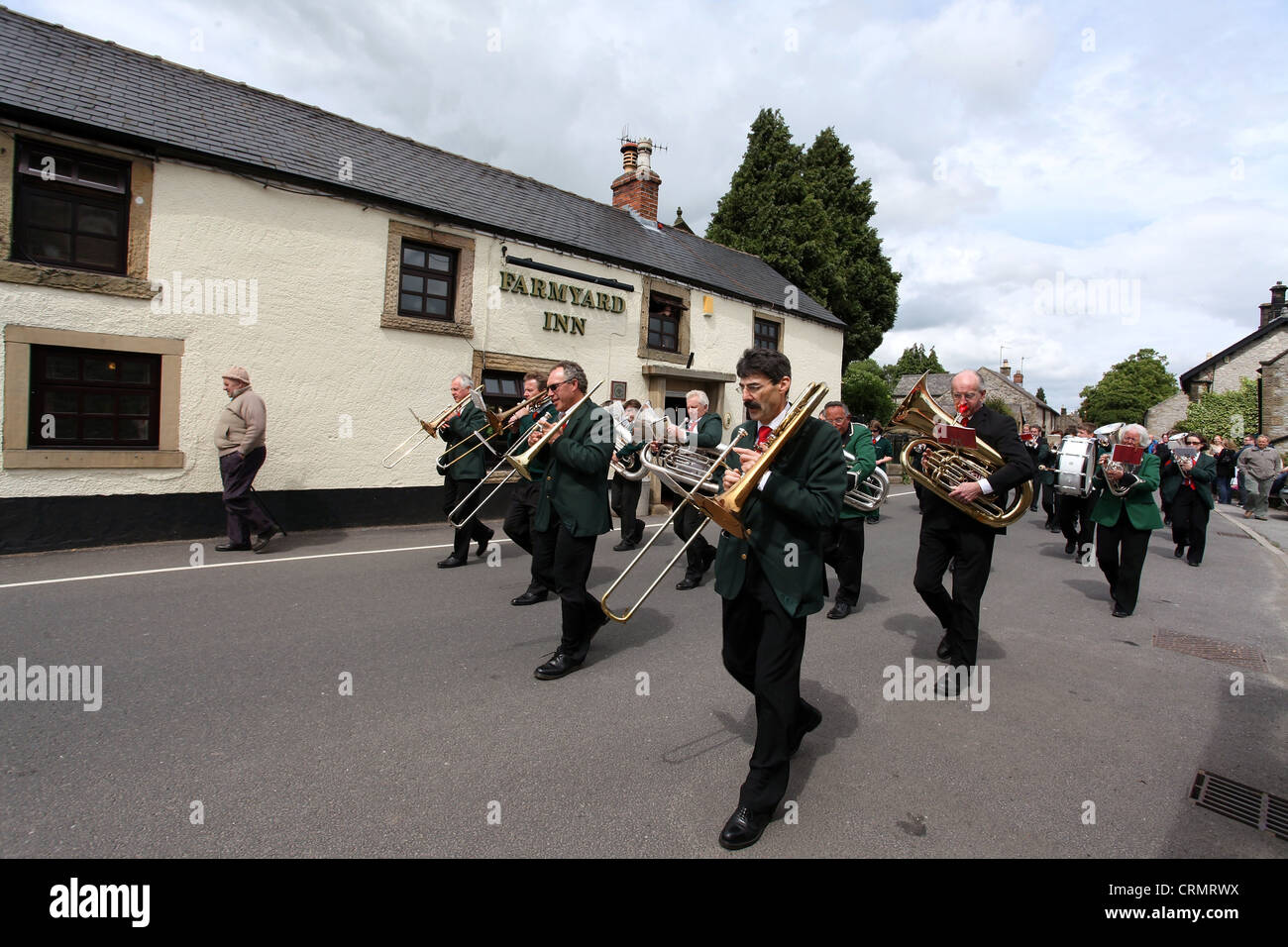 The Village Band Marching Through the Derbyshire Village of Youlgreave for the Blessing of the Well Dressings Stock Photo