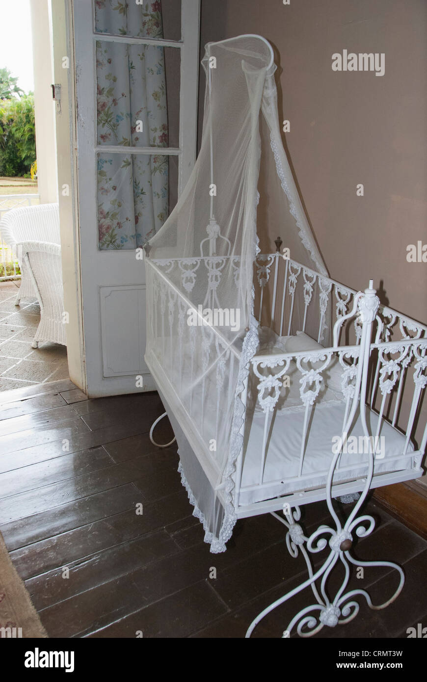 Island of Mauritius. Eureka House, fine restored colonial home built in 1834. Vintage baby cradle. Stock Photo