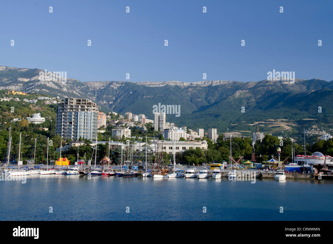 Ukraine, Yalta. Black Sea harbor view of the port of Yalta with the Crimean  Mountains in the distance Stock Photo - Alamy