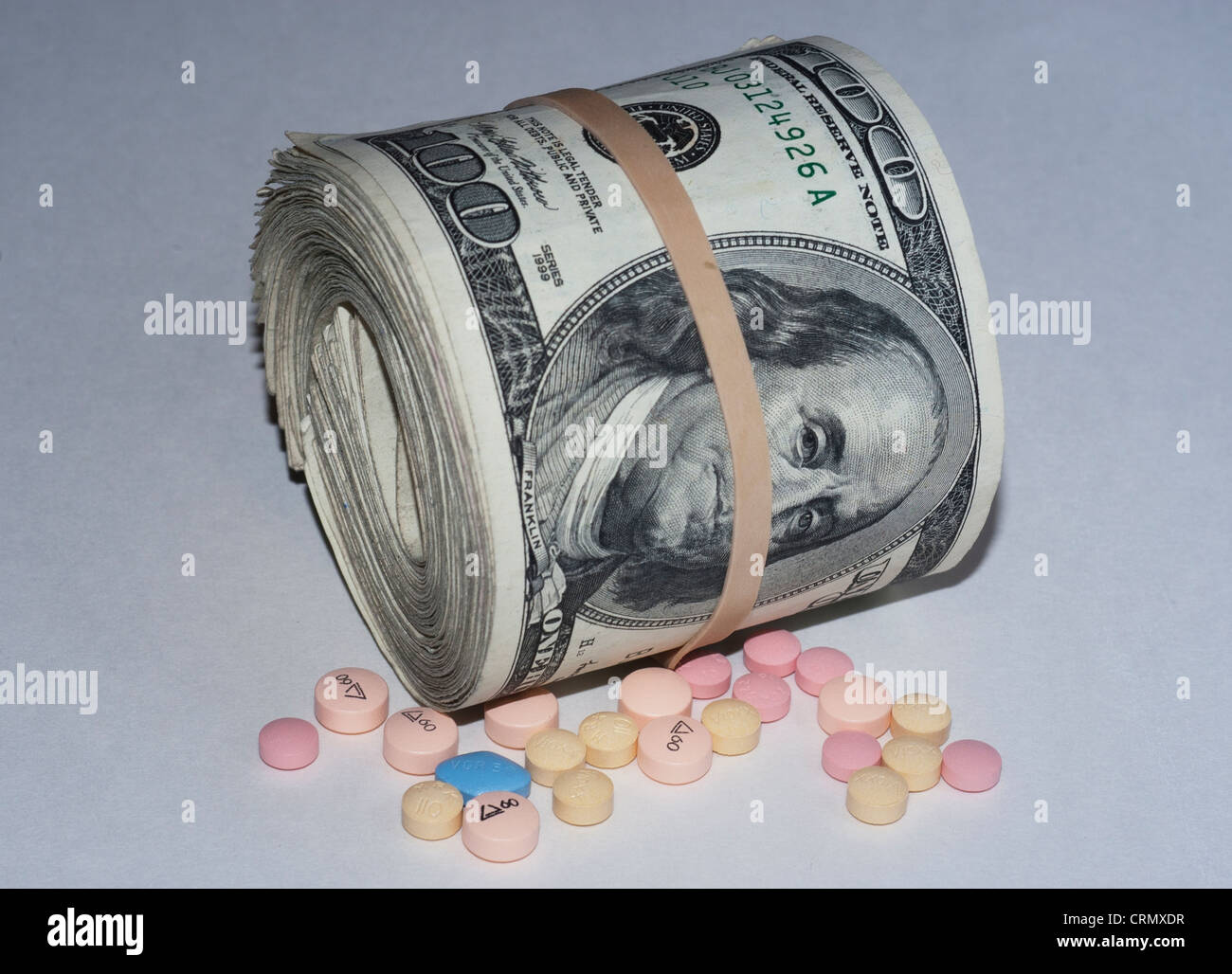 dollar bills and medications Stock Photo