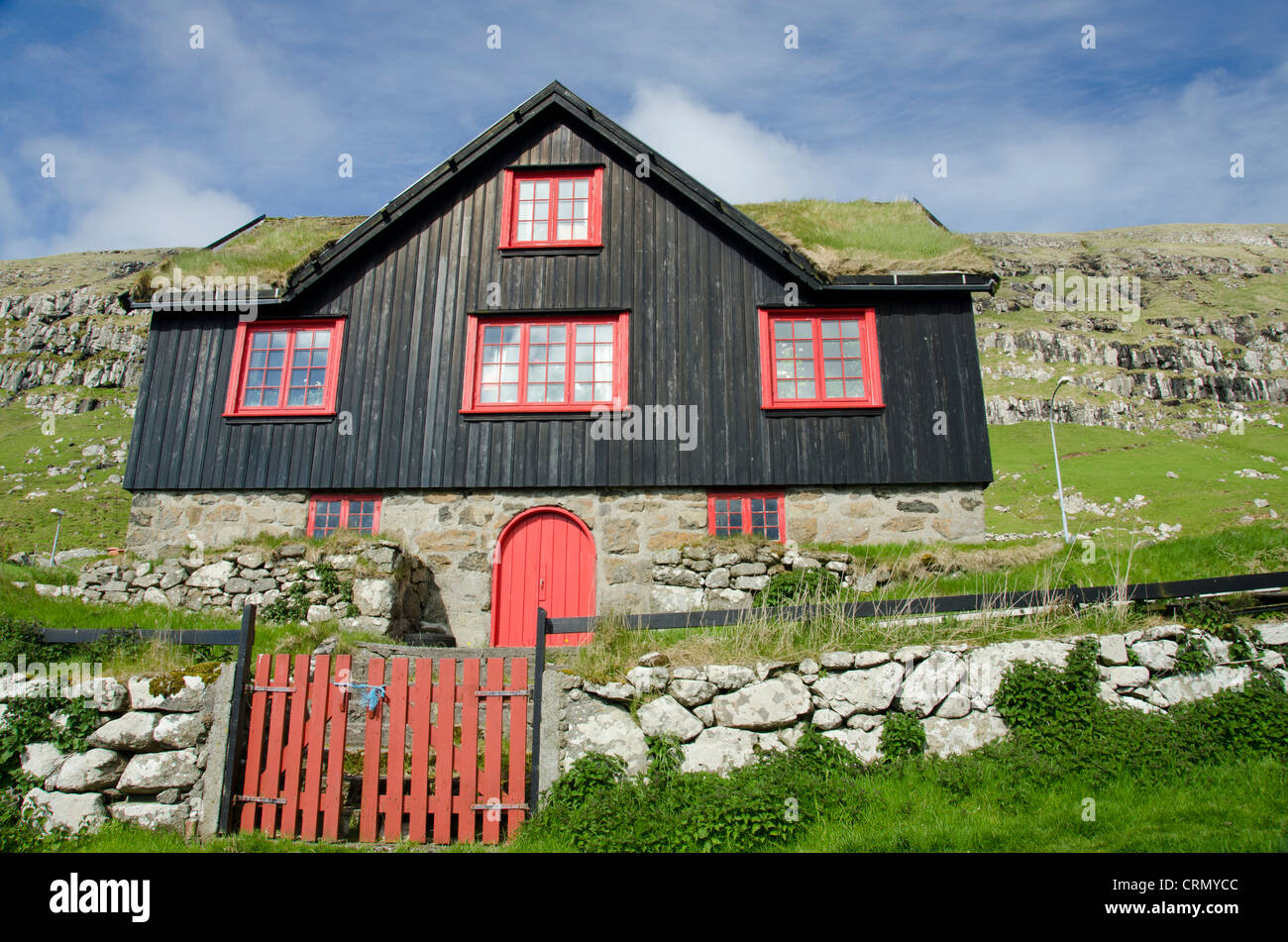 Kingdom of Denmark, Faroe Islands (aka Foroyar). Historic outdoor museum, Kirkjubor Village. Old farm house with sod roof. Stock Photo