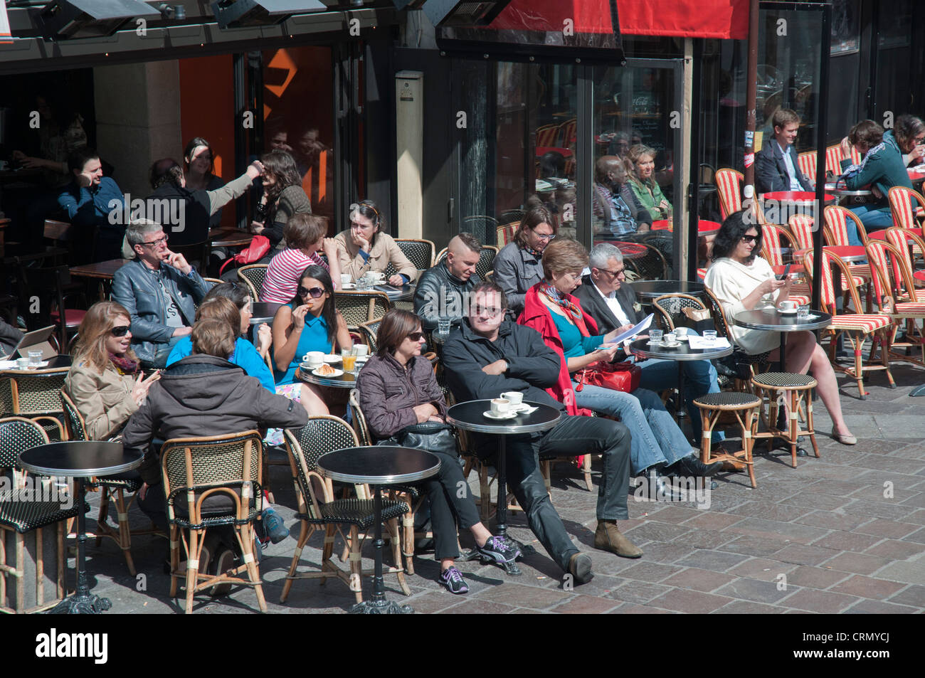 Parisians seated outside a cafe on the Left Bank Stock Photo