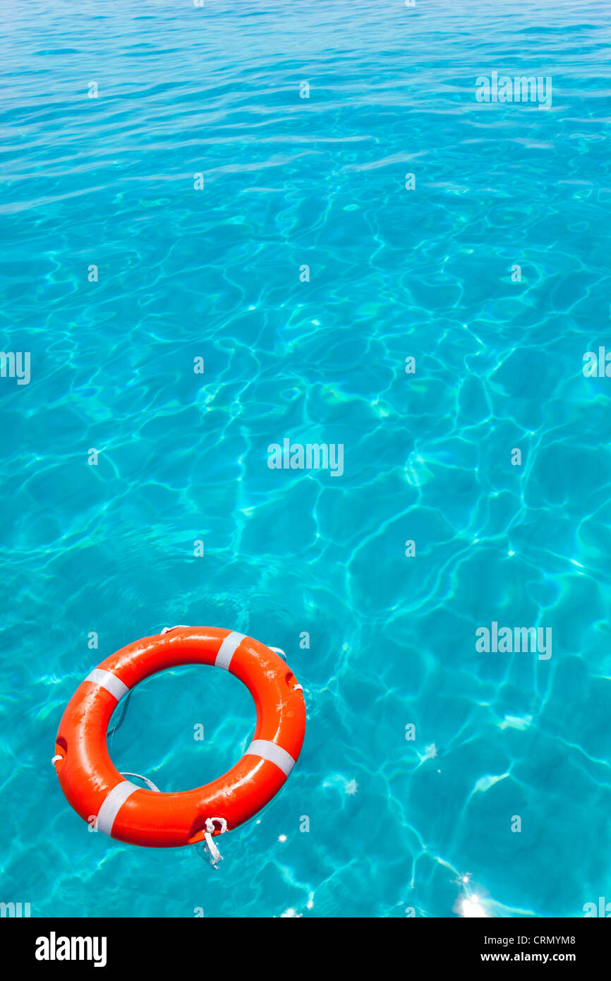 Buoy orange round floating in perfect tropical beach with turquoise water Stock Photo