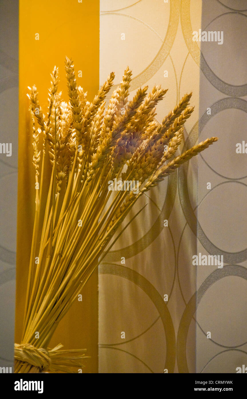 Decorative vase of wheat against wallpaper Stock Photo - Alamy