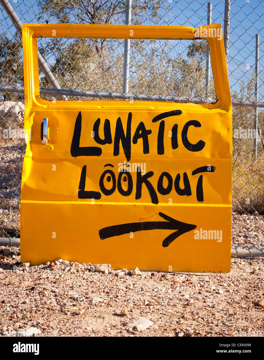 Classic Australian outback bush humour, with a car door pointing to Lunatic Lookout Stock Photo
