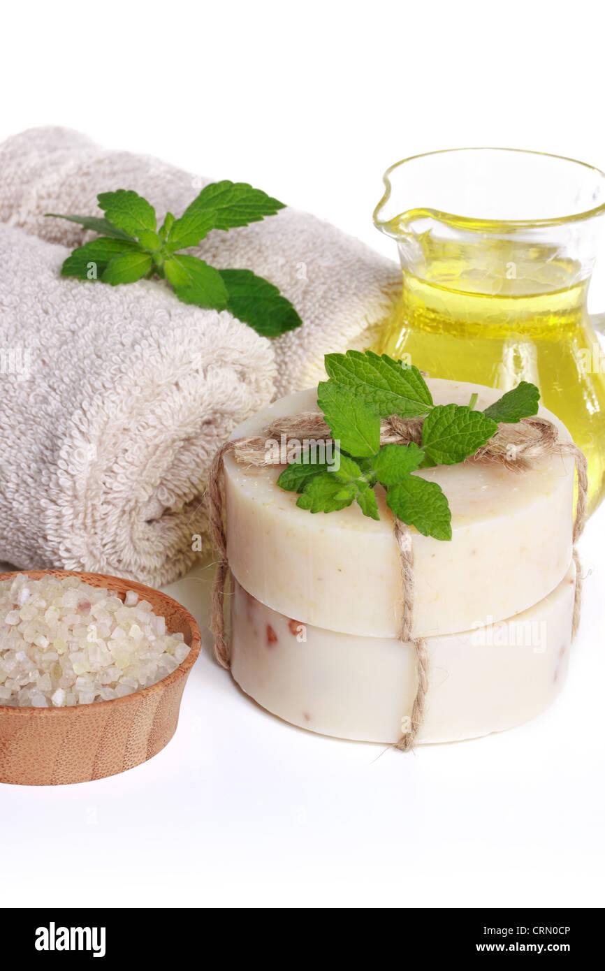 Towels, Body Salt, Soap and Essential Oil on white background Stock