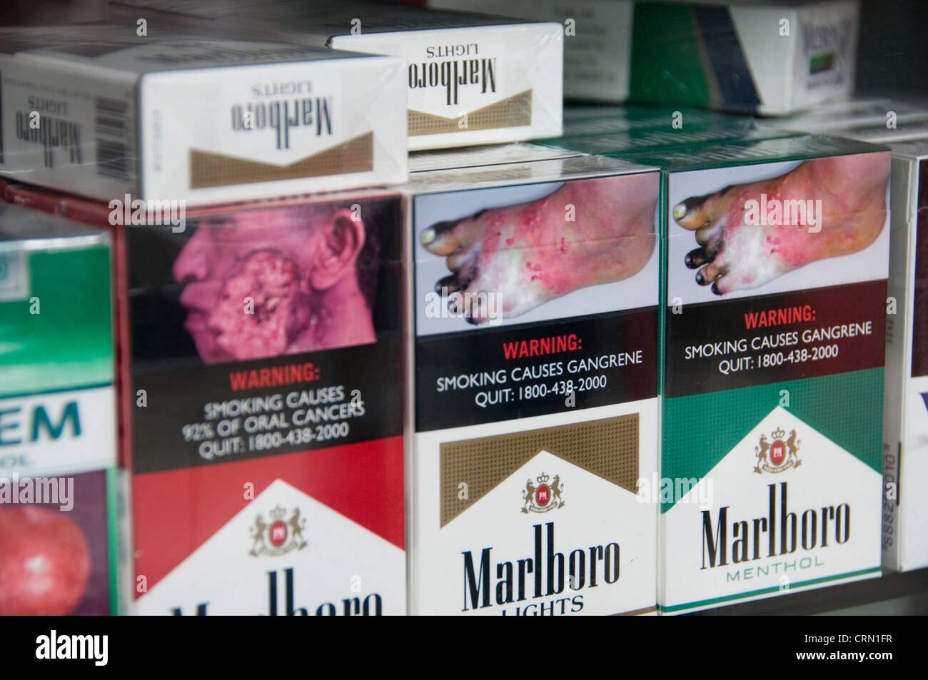 morbid graphic cigarette packages at convenience store in Singapore Stock Photo