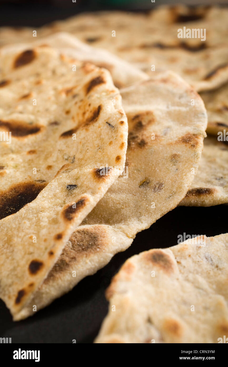 Close up shot of indian chapatis, or roti, traditional unleavened bread to eat with curry. Shallow DOF. Stock Photo