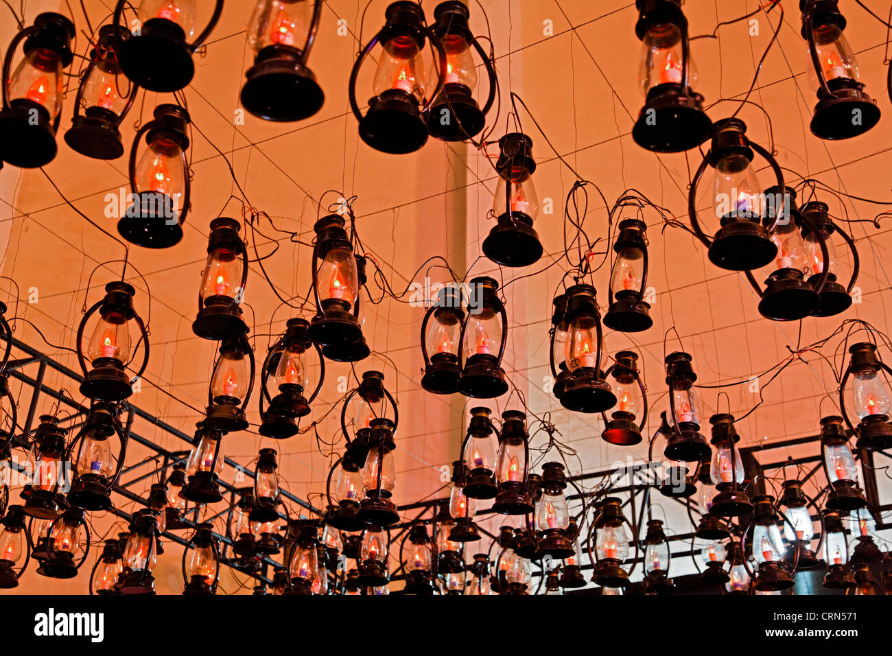 Texture of conceptual lighting arrangement of tungsten lanterns hanging from the ceiling Stock Photo