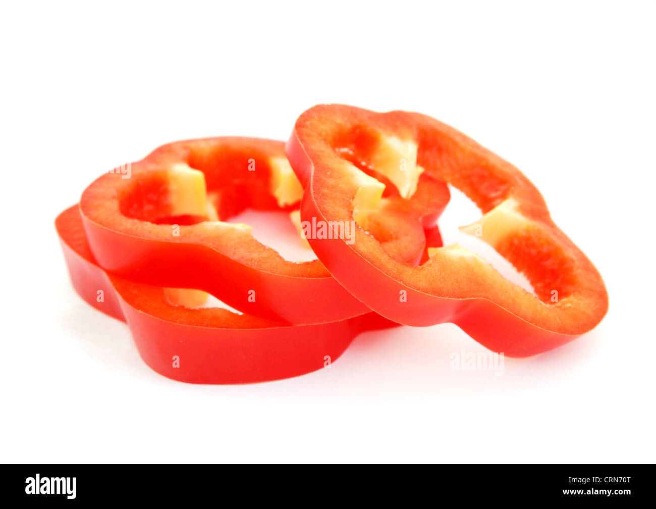 Slices of red bell pepper isolated on white background Stock Photo - Alamy