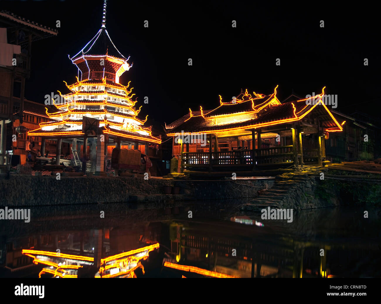 Village of Zhaoxing by night, Guizhou province - China Stock Photo