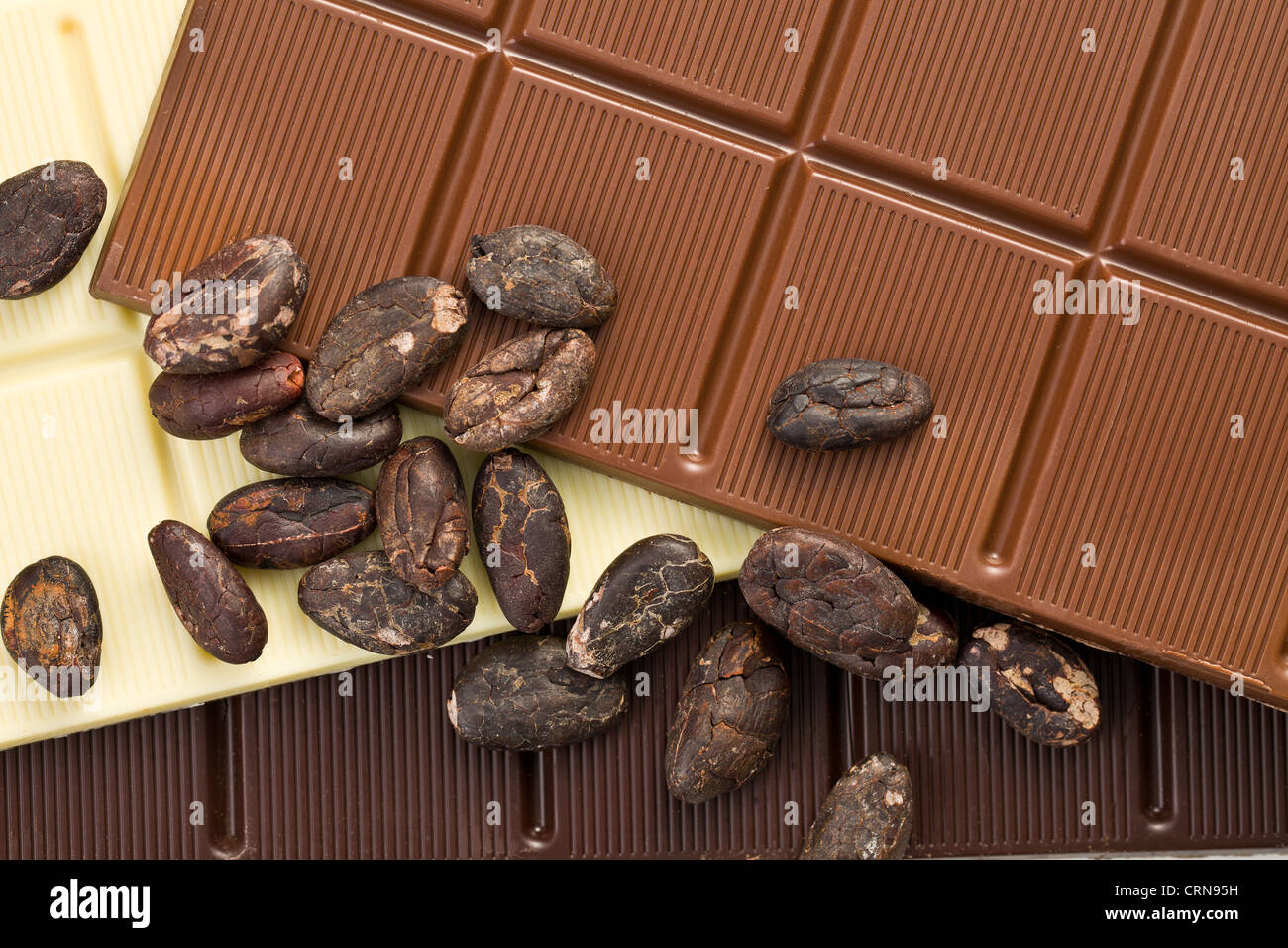 the various chocolate bars with cocoa beans Stock Photo
