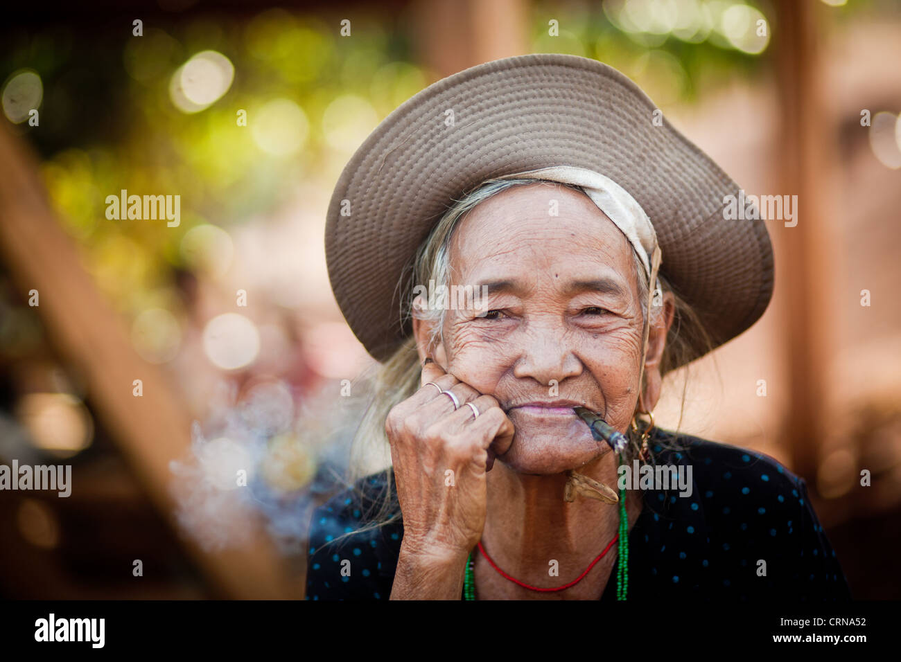 old woman smoking cigarette in Cat Tien National Park Vietnam Stock ...