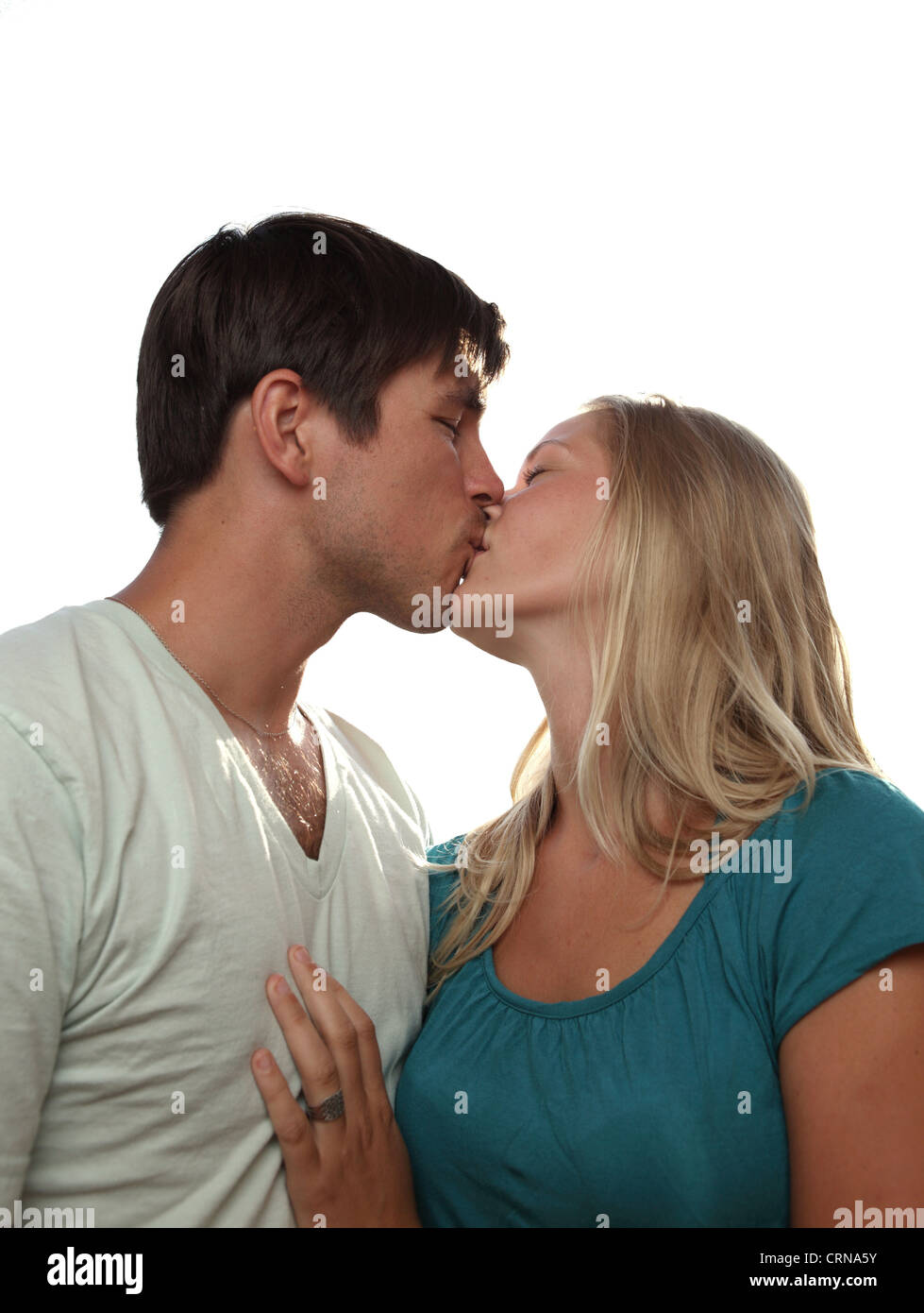 Lovingly Young lovely couple kissing lovingly - isolated on white Stock Photo ...