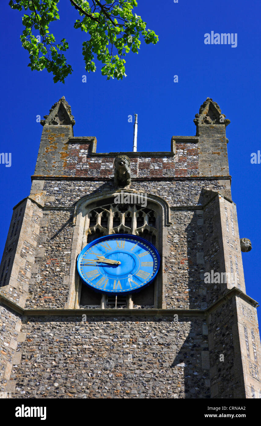 A view of the tower and clock of the parish church of St Martin at New Buckenham, Norfolk, England, United Kingdom. Stock Photo
