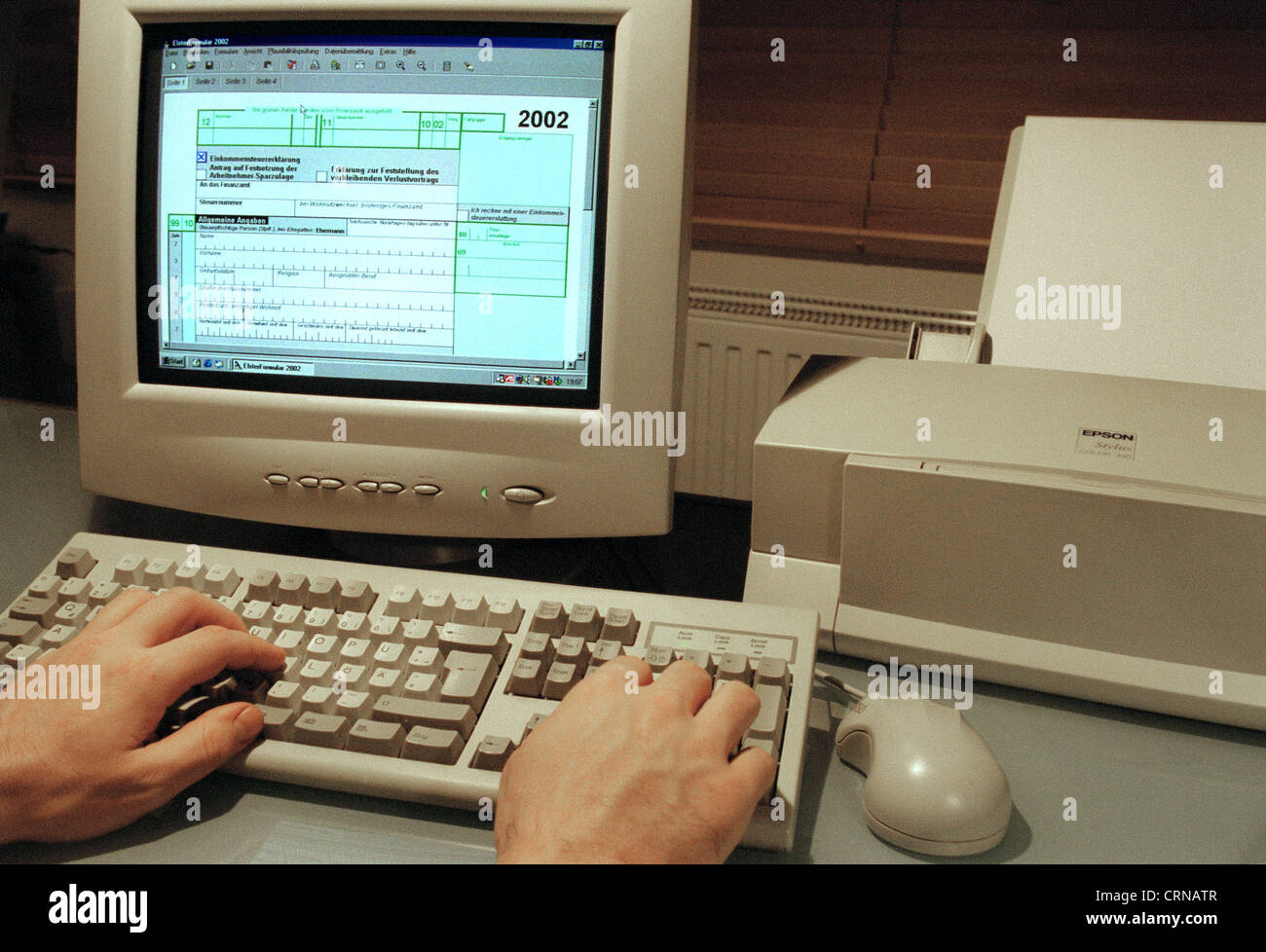 Tax return on the PC with the magpie Stock Photo