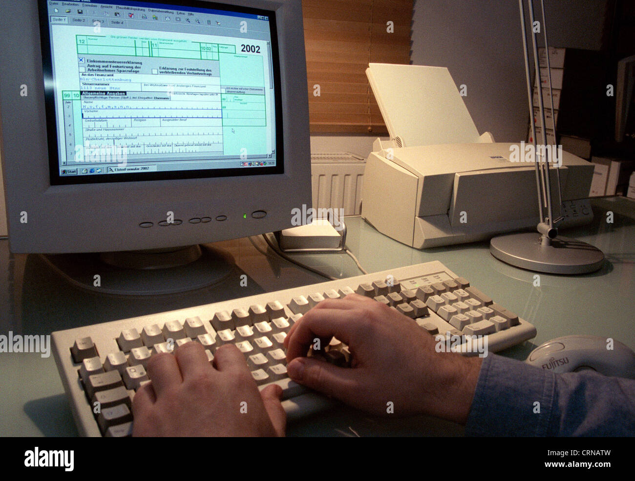 Tax return on the PC with the magpie Stock Photo