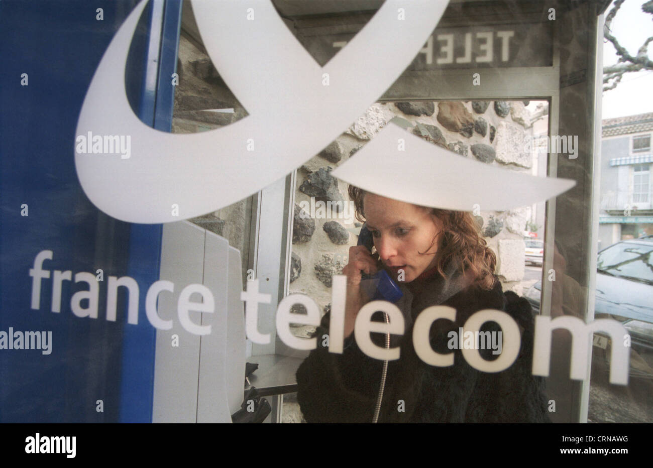 French woman in the phone booth france telecom Stock Photo