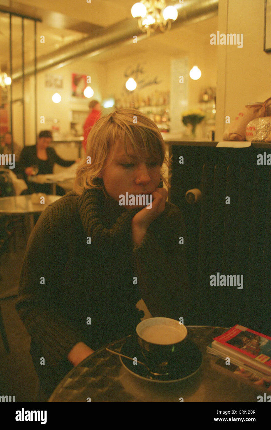 a-young-woman-in-a-cafe-in-copenhagen-stock-photo-alamy