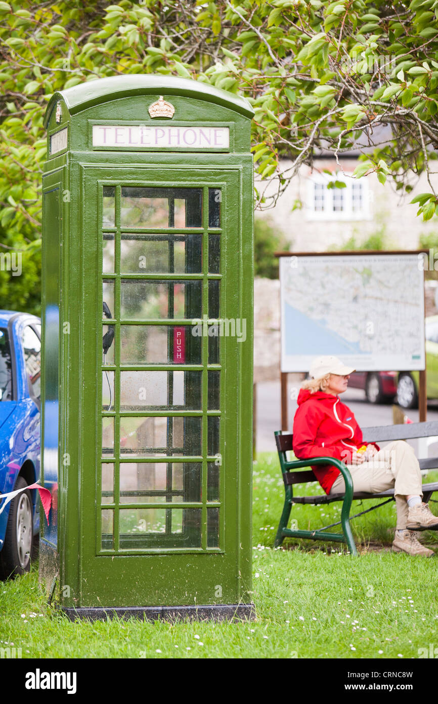 A green telephone box in Portesham, a traditional rural village in Dorset, UK. Stock Photo