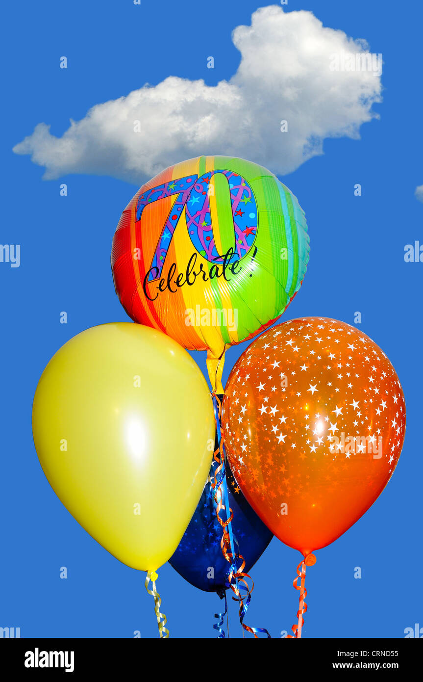 A bunch of 70th Birthday balloons against a blue sky Stock Photo - Alamy