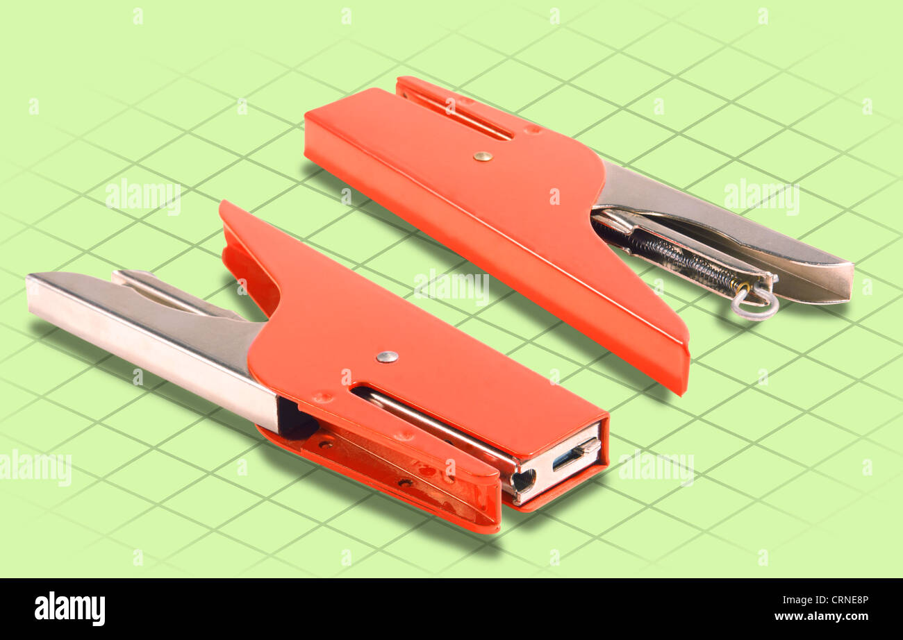 ISOMETRIC Photograph Isolated on grid and Green BG of a red Stapler ...