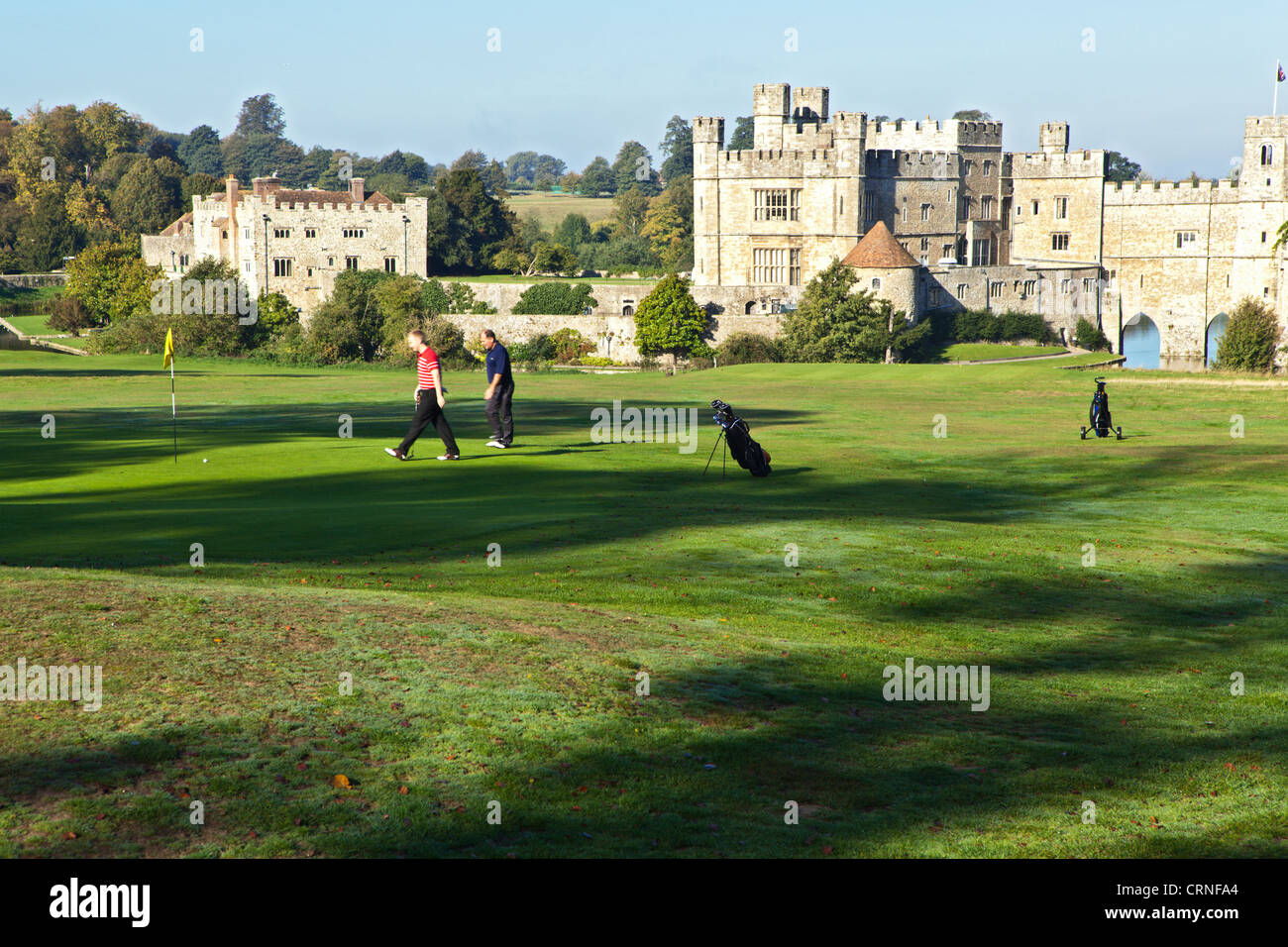 Golfers playing on the course at Leeds Castle. Stock Photo