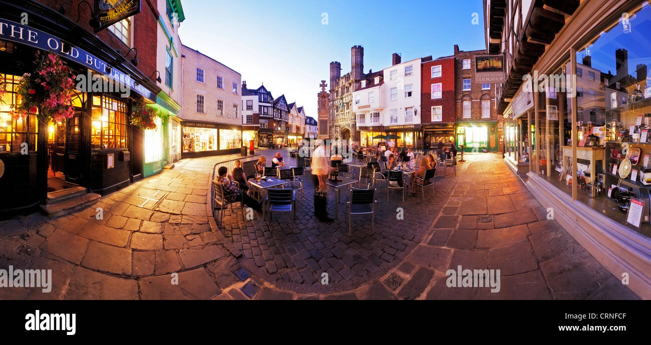 Panoramic view of people eating and drinking outside The Old Buttermarket in Canterbury. Stock Photo