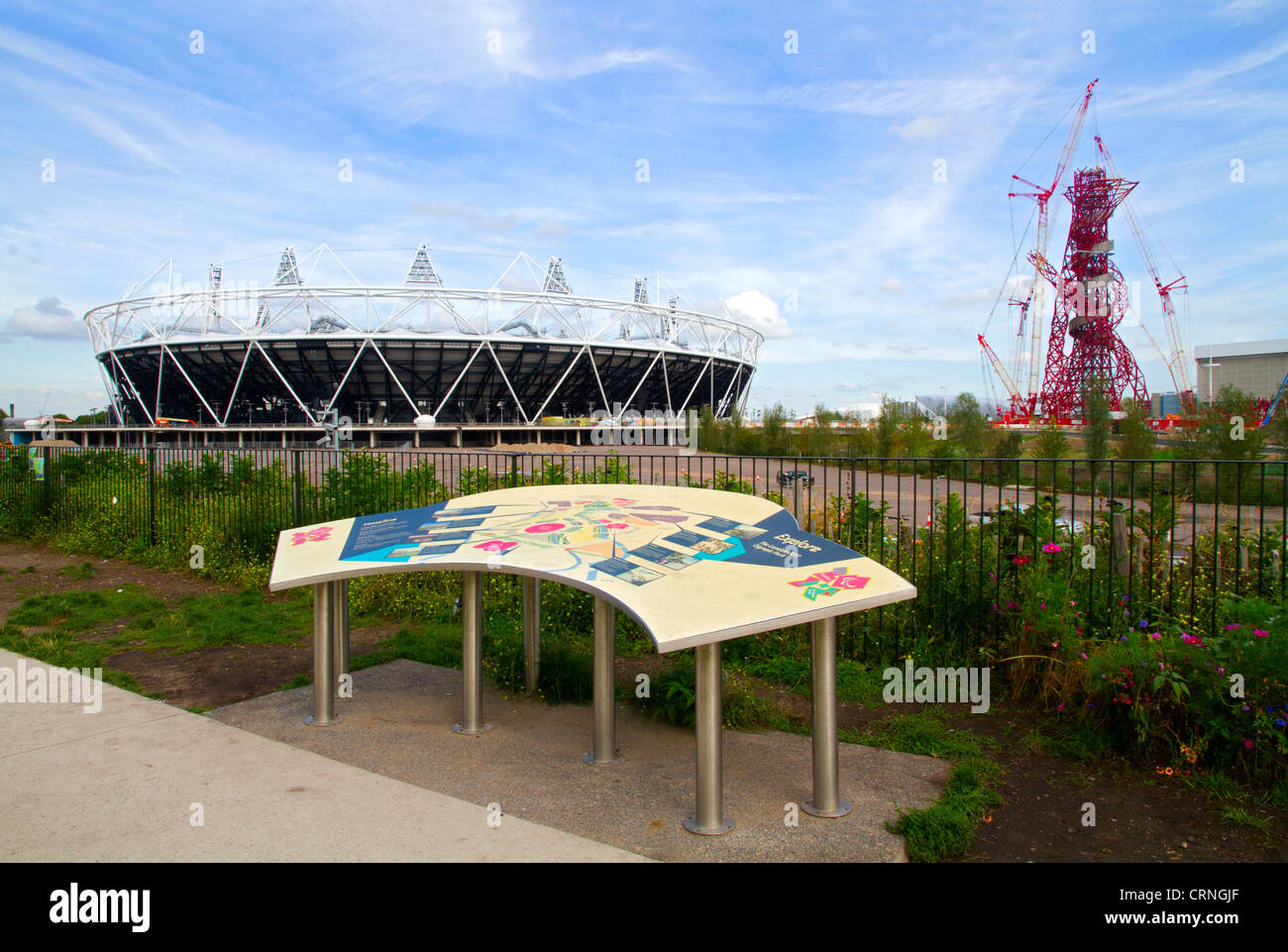 The London 2012 Olympic stadium, the ArcelorMittal Orbit observation tower and site map in the Olympic Park in Stratford in the Stock Photo