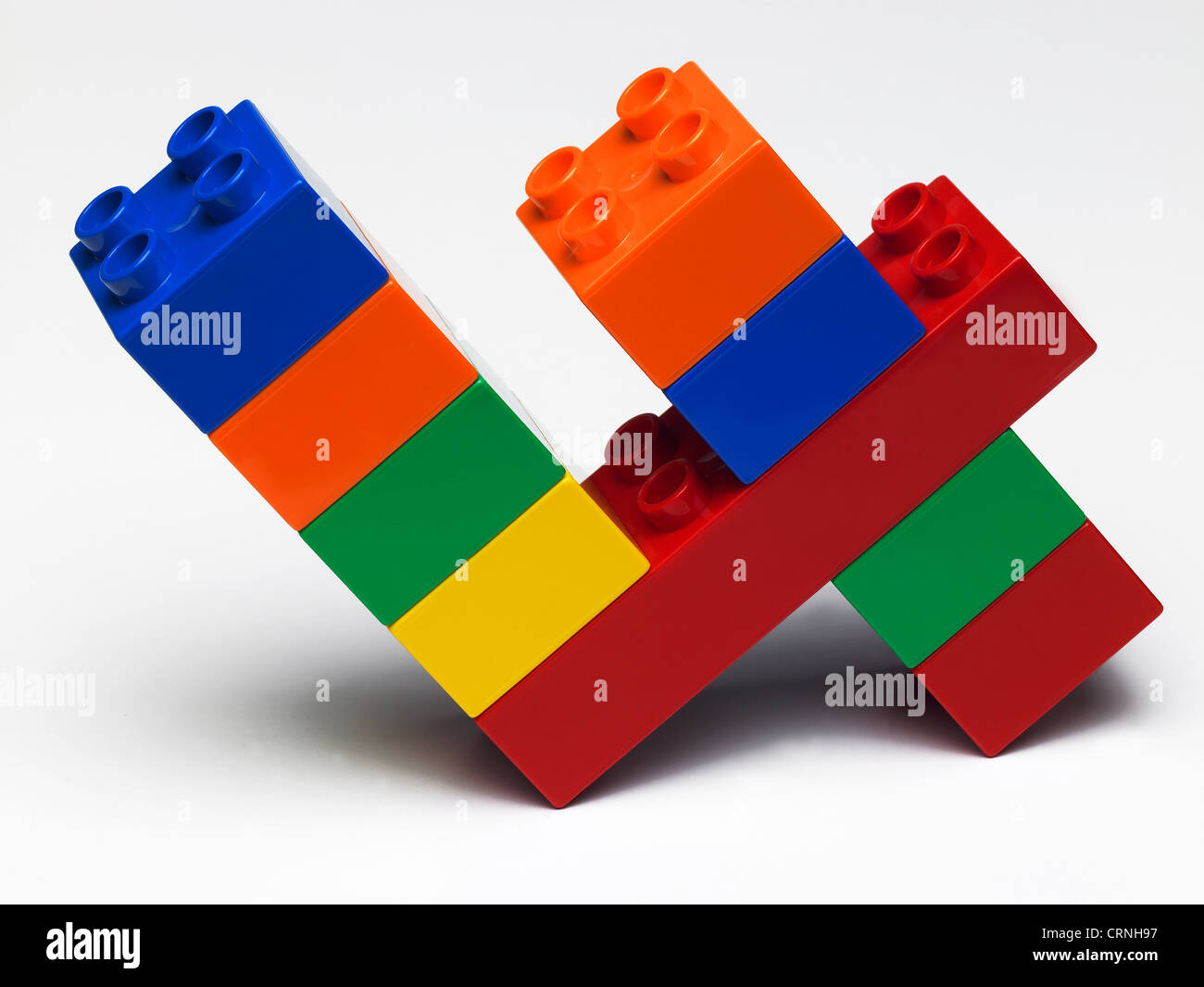 Coloured plastic building bricks in the shape of the number 4 Stock Photo