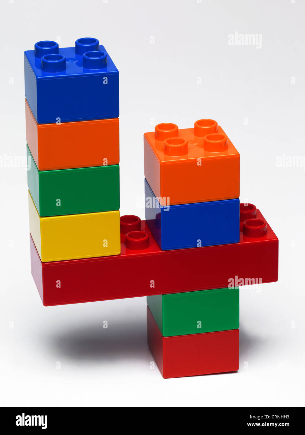 Coloured plastic building bricks in the shape of the number 4 Stock Photo