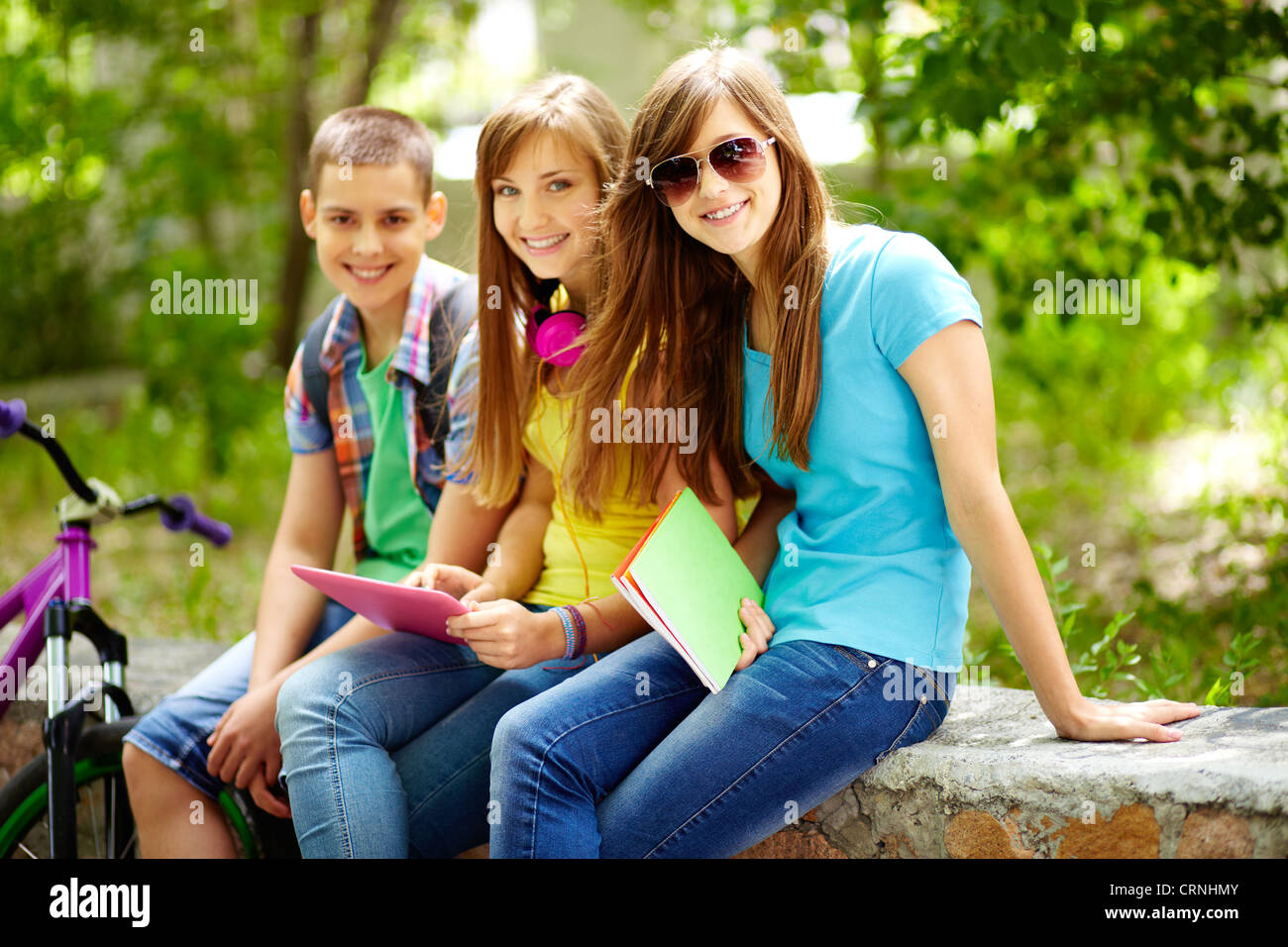 Three friends enjoying their free time after school classes Stock Photo ...