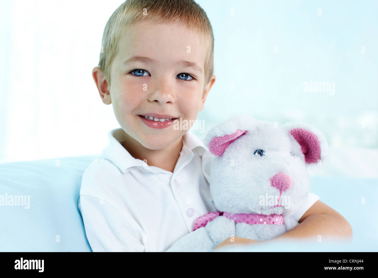 Close-up portrait of a cute boy hugging his teddy bear Stock Photo - Alamy