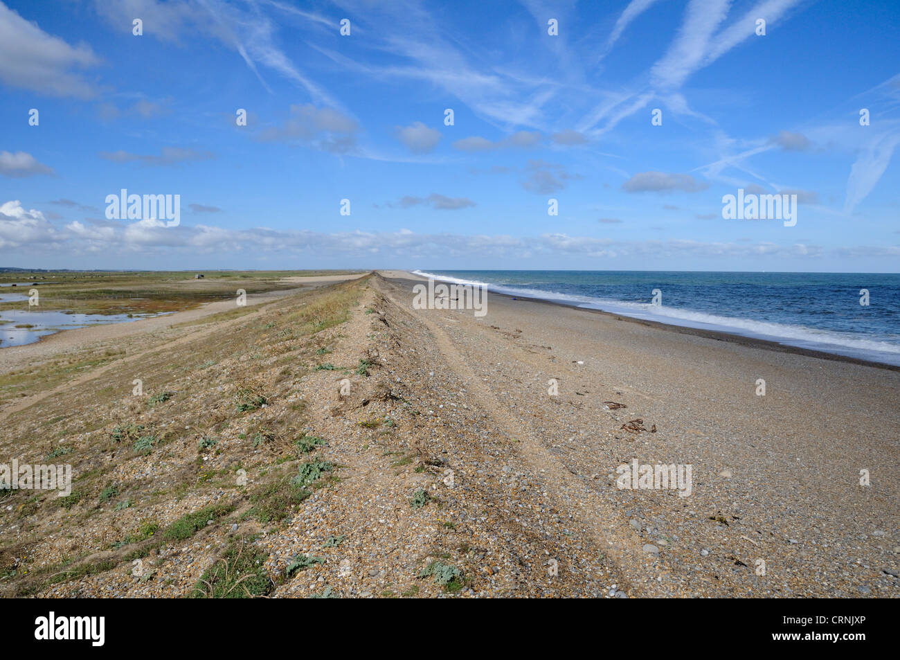 Shingle sea bank at Norfolk Wildlife Trust (NWT) Cley Marshes Cley nature Reserve separating grazing marsh and the sea. Stock Photo