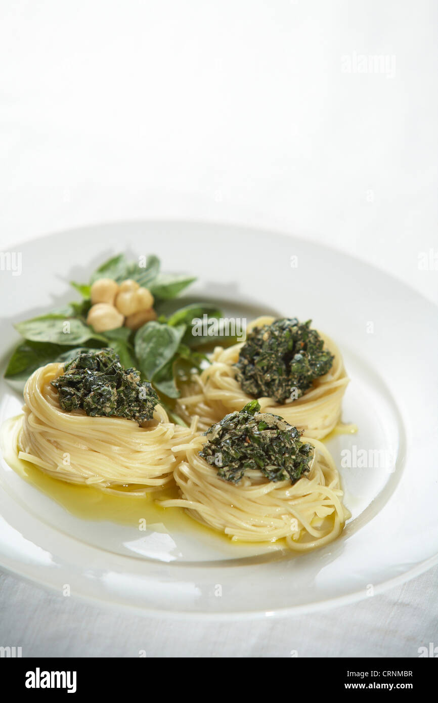 Pesto pasta with macadamia nuts Stock Photo Alamy